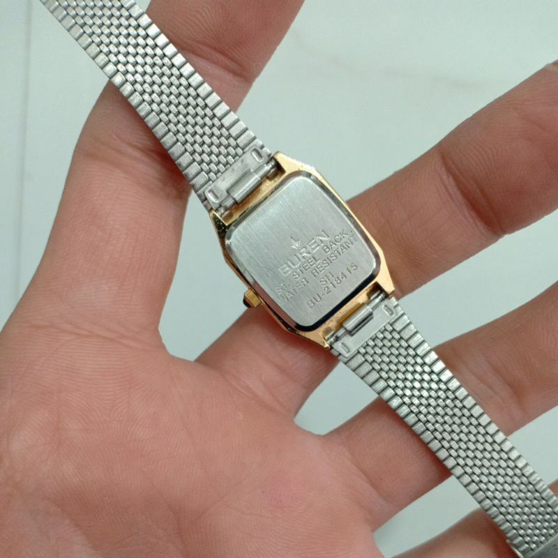 Đồng hồ si nữ mặt vuông tank hiệu BUREN dây thép lụa mạ vàng độ mới cao 91%