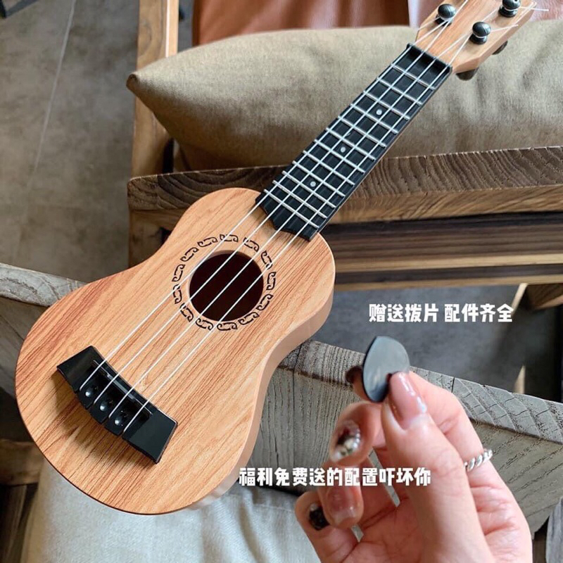 Đàn guitar mini cho bé