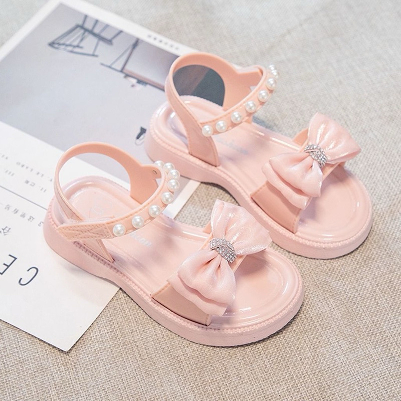 Sandal quai ngọc gắn nơ siêu xinh cho bé gái từ 4 đến 12 tuổi chất liệu nhựa mềm êm đế chống trơn trượt