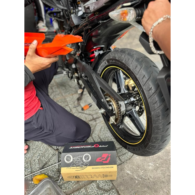 Phuộc Profender Exciter 150 1 tăng chỉnh Lò xo đỏ, BH 3 năm