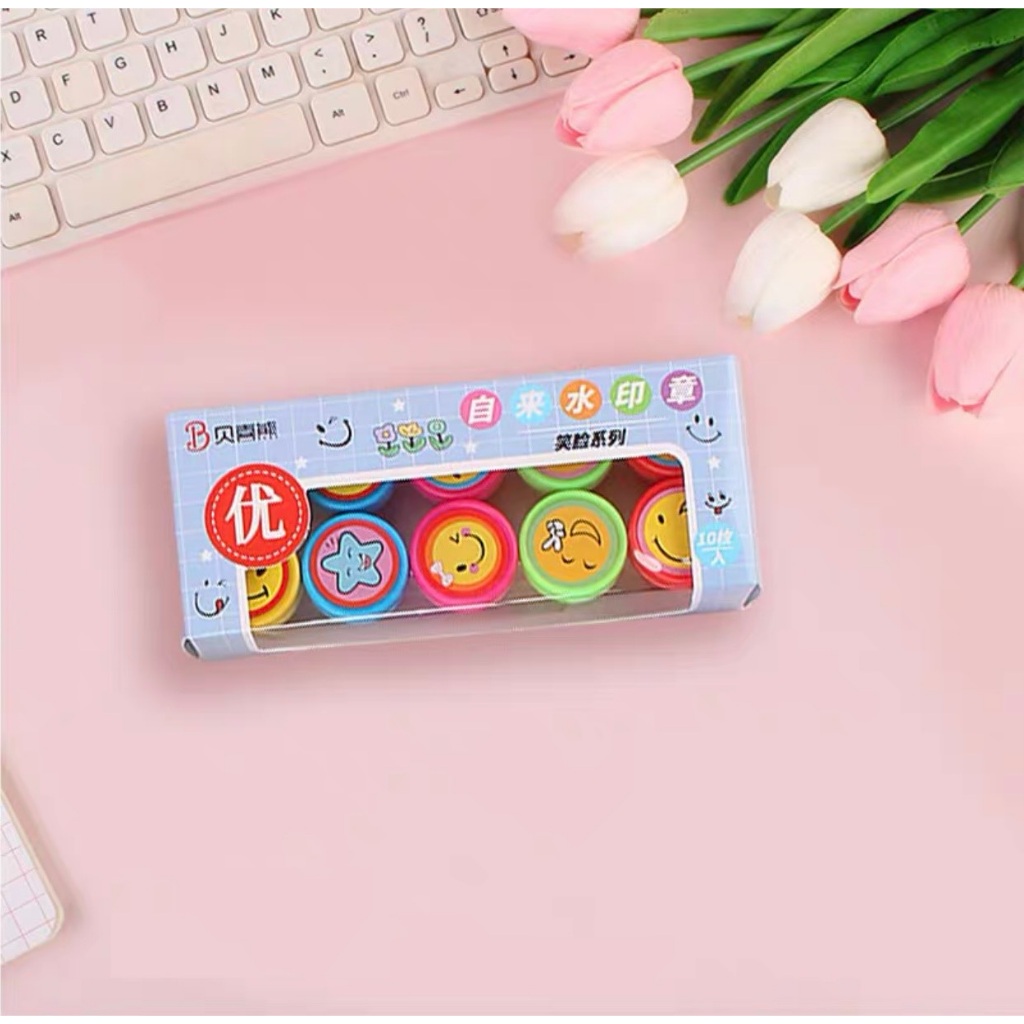 1 con dấu đã có sẵn mực hình mặt cười cho cô giáo chấm điểm và quà tặng cho bé