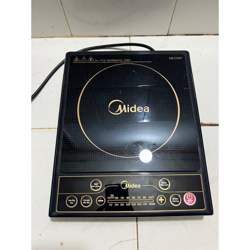 Thanh lý bếp từ Midea phím bấm còn mới mặt kính bị nứt như hình
