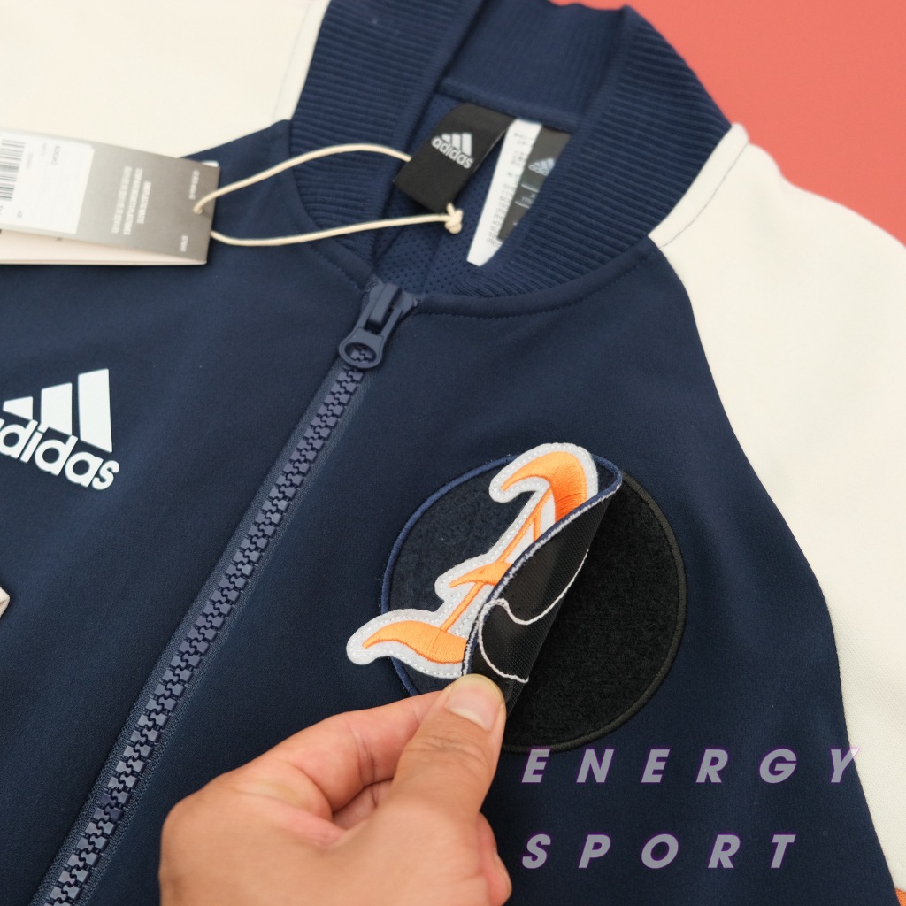 Áo Khoác Bomber Thể Thao Unisex Adidas VRCT Jacket Kem/Navy - DX8408