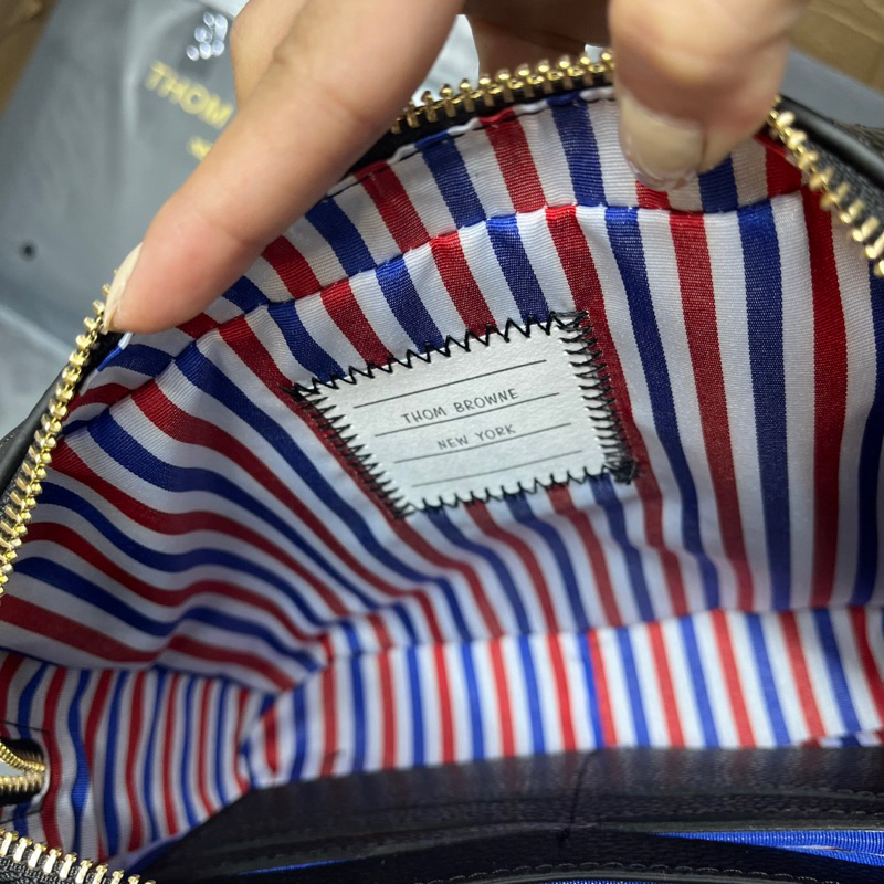 Túi tommy cầm tay nam clutu thom