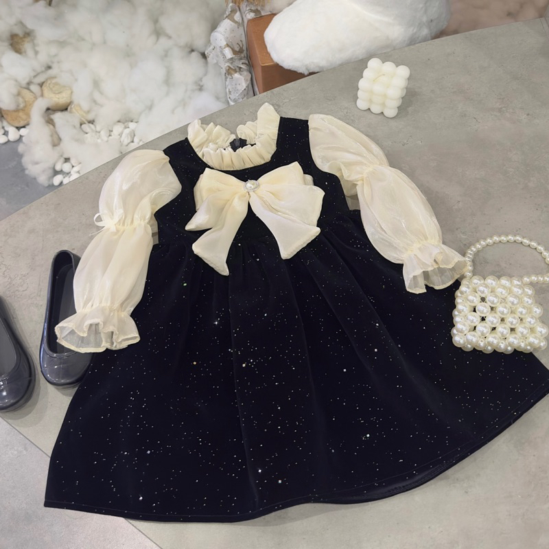 Váy nhung đen nhũ phối tay nơ voan bé gái