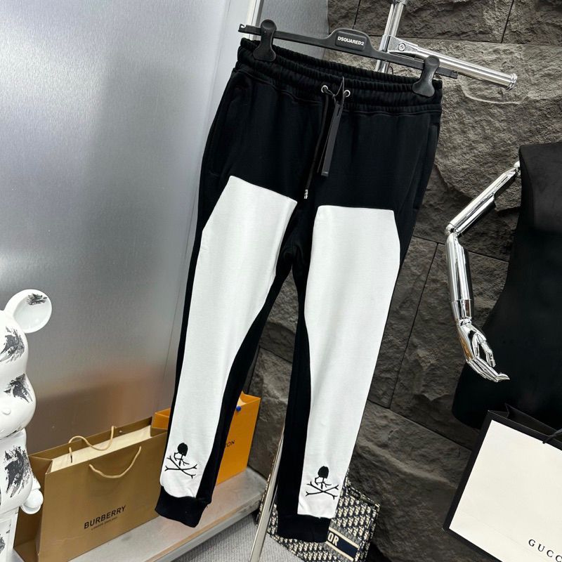 Quần Jogger Dài Nam Mastermind Nỉ Chân Cua Đen Ghép Vải Trắng Dọc Thân Thêu Hình Xương Đầu Lâu Cho Các Boy Phố Đi Chơi