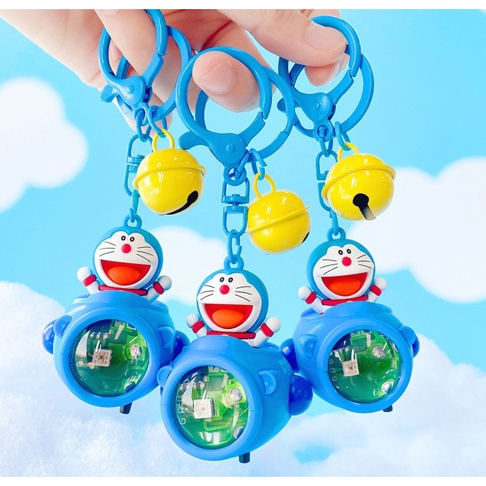 Móc khoá Doraemon phi thuyền có đèn pin chiếu sáng đổi màu