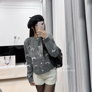 Áo len xù đính nơ cúc ngọc | studioby25