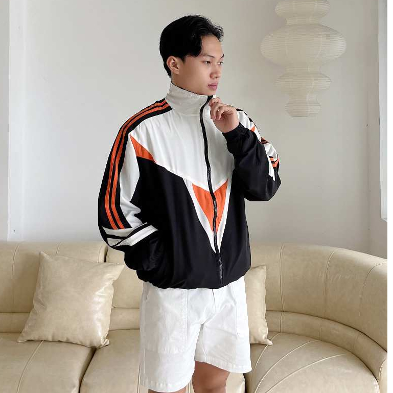 Áo khoác dù phom rộng unisex 5 CAPMAN màu đen phối trắng cam