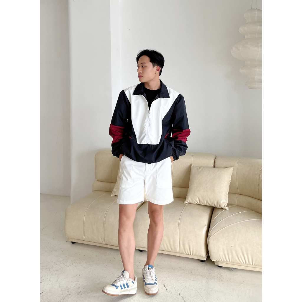 Áo khoác dù khóa zip lỡ phom unisex CAPMAN màu trắng phối đen đỏ