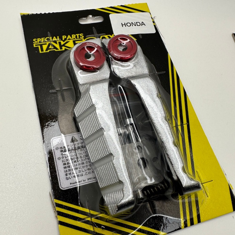 Gác chân nhôm đúc takegawa gắn xe máy