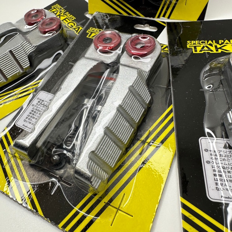 Gác chân nhôm đúc takegawa gắn xe máy