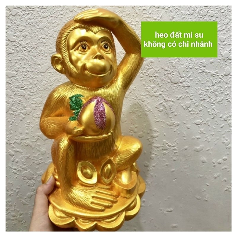 ỐNG HEO KHỈ CẦM ĐÀO TIÊN VÀNG SÁNG ĐẸP BỀN MÀU CHẤT LIỆU THẠCH CAO (cao 31*ngang17)