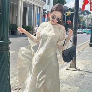 Áo dài nữ cách tân thi thư linn design thiết kế áo dài saam cover chất liệu tơ thêu hoa màu be