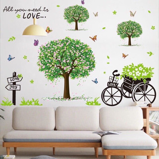Decal dán tường trang trí xe đạp và ba cây hoa xanh