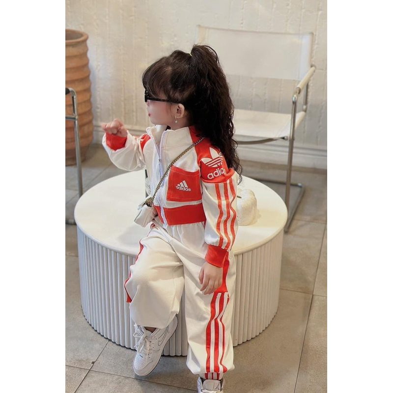 Bộ das viền cam bé gái