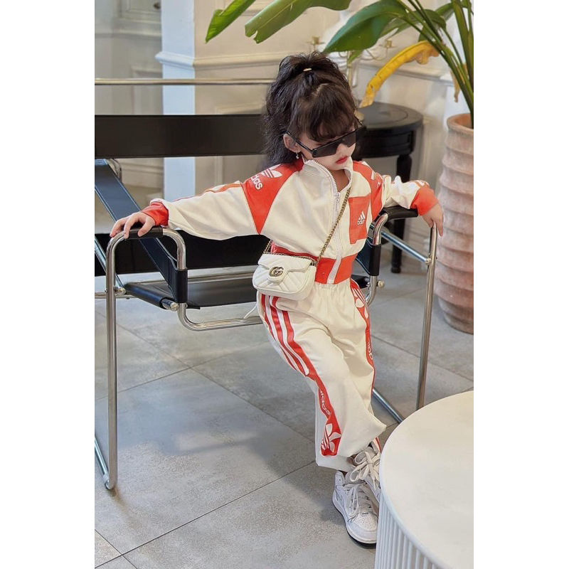 Bộ das viền cam bé gái