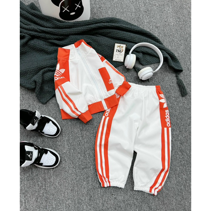 Bộ das viền cam bé gái