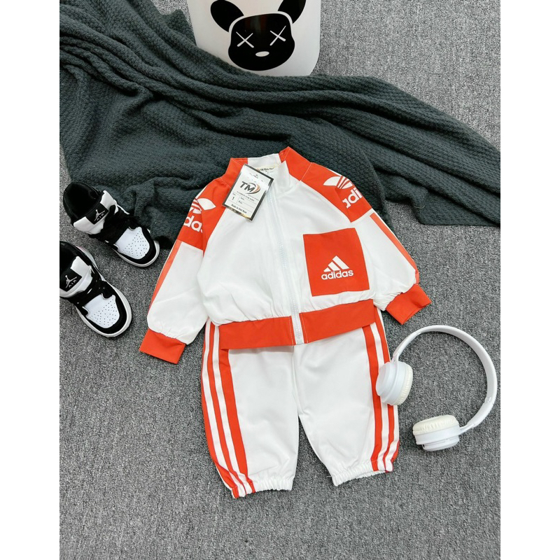 Bộ das viền cam bé gái