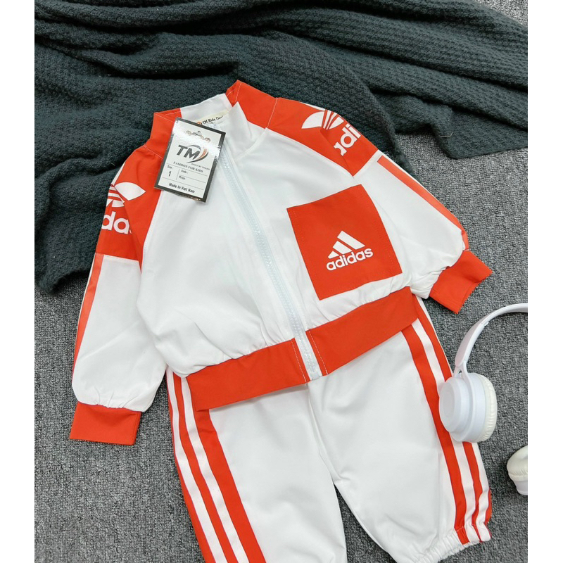 Bộ das viền cam bé gái