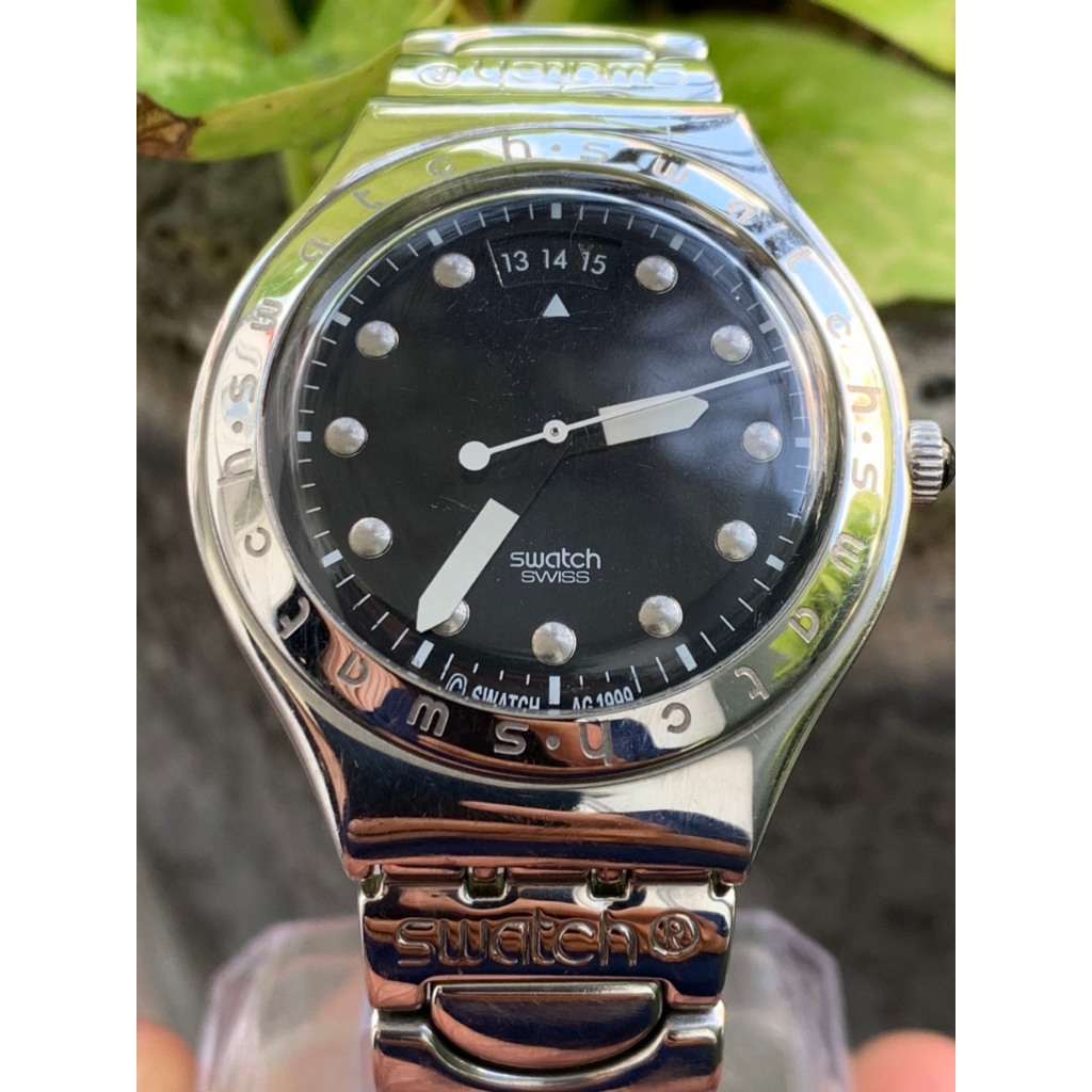 Đồng hồ nam Swatch Pin  kim dạ quang, dây kim loại  của Thuỵ