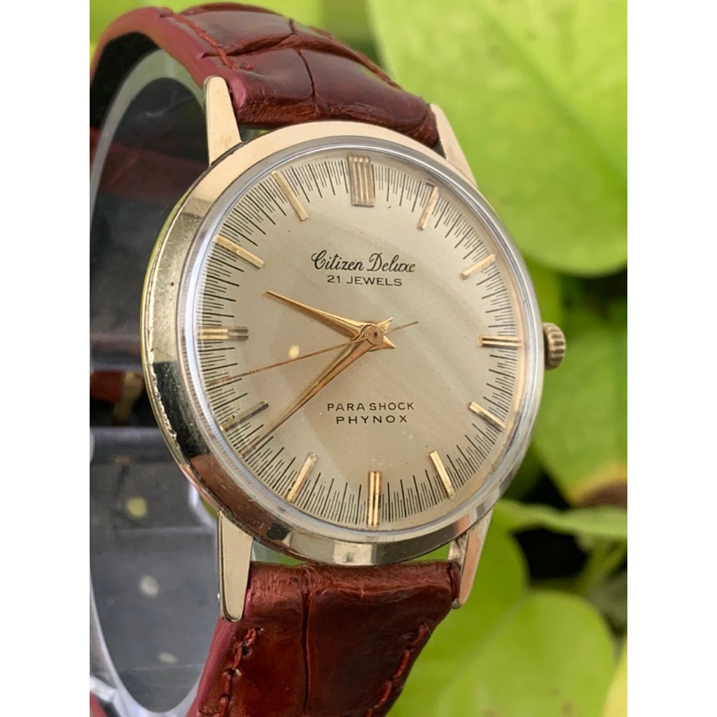 Đồng hồ nam Citizen Deluxe Parashock Phynox cơ cót 21 jewels, lắc kê vàng dây da của Nhật