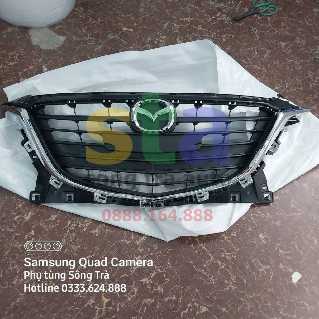 Mặt ca lăng Mazda 3. Lô gô ga lăng Mazda 3. Nẹp mạ crom ga lăng Mazda 3 2015 - 2017