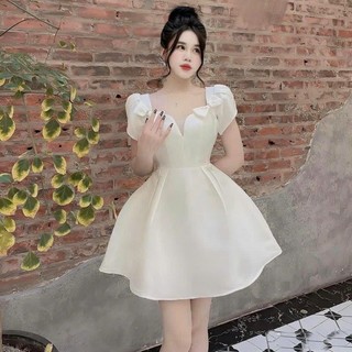 Đầm baby nữ mặc đi dự tiệc sang chảnh chất Tapta cổ vuông xẻ ngực 2 bên vai đính nơ tay ngắn mix dáng váy xoè dài mini.