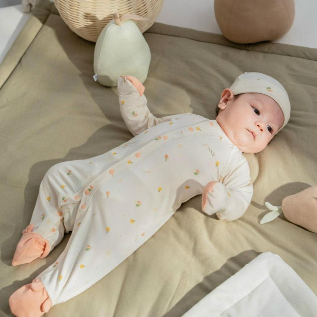Bộ liền dài tất màu be in họa tiết màu cam NB