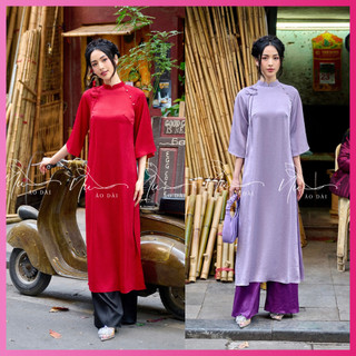 Áo dài truyền thống màu tím dáng xuông lụa tằm ướt, nơ cách điệu trước ngực, kiểu dáng trẻ trung