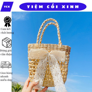 Túi cói lục bình nhỏ đan họa tiết hoa thị quai tết gắn nơ hoa dễ thương