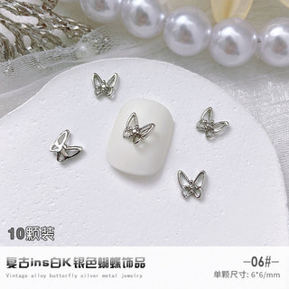 Charm bướm nơ kim loại bạc