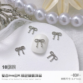 Charm bướm nơ kim loại bạc