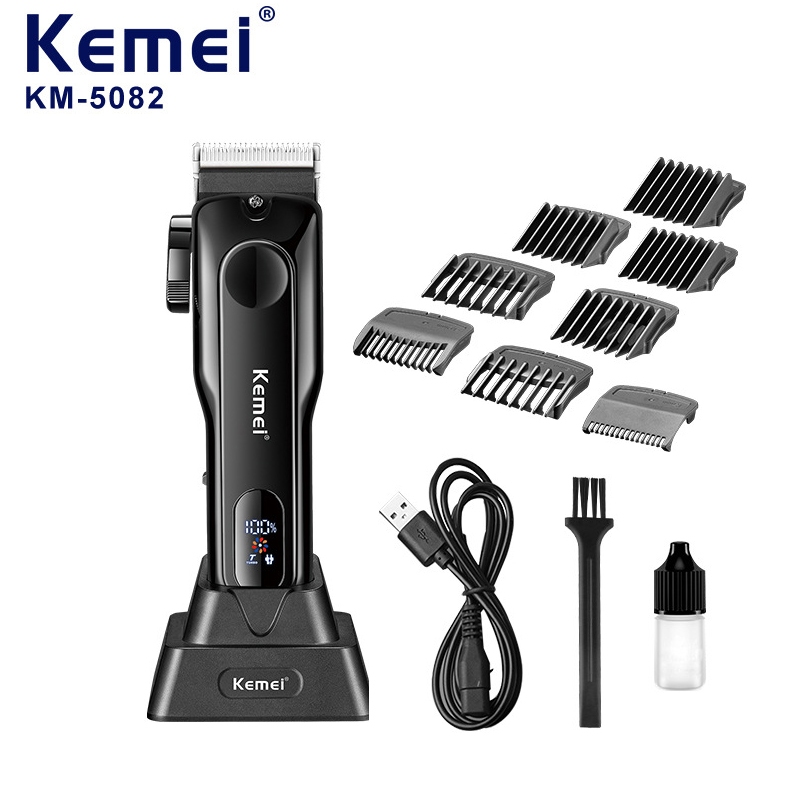 Tông đơ cắt tóc Kemei KM-5082 có đế sạc tiện lợi.