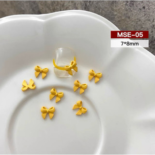 CHARM NƠ VÀNG SET 12 VIÊN M704