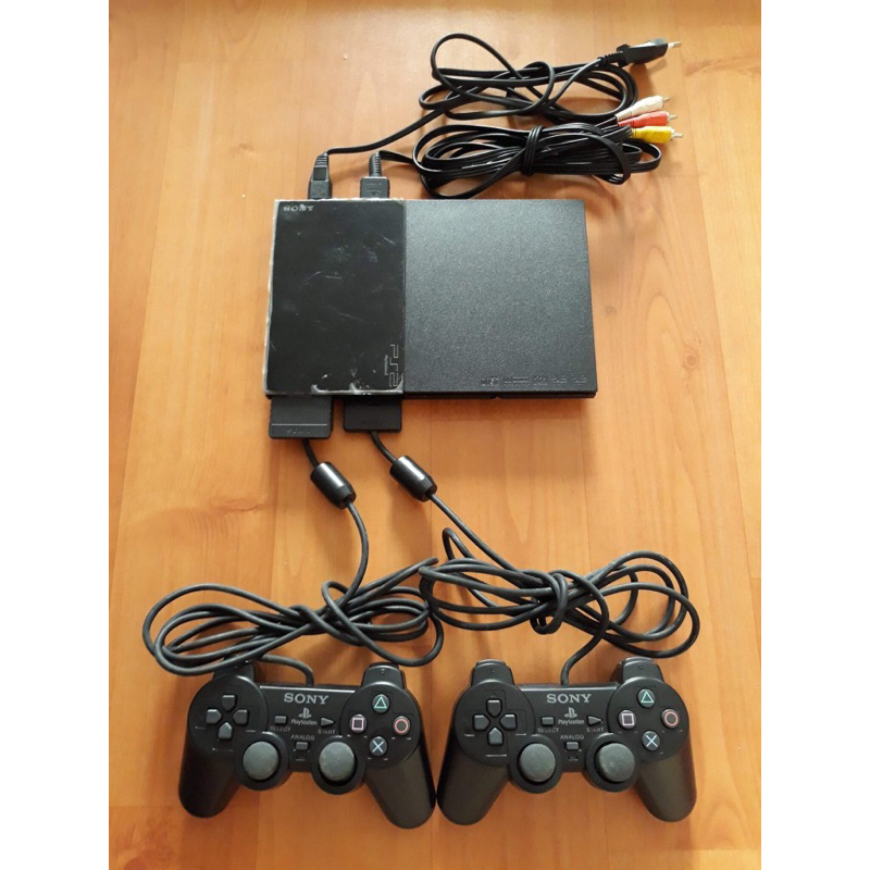 Ps2 slim 9xxx chơi đĩa kèm 2 tay new + pk đầy đủ + tặng đĩa pes24 tv