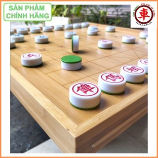 Combo bàn gỗ trúc + cờ tướng đế xanh