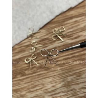 charm nơ thắt xinh xắn