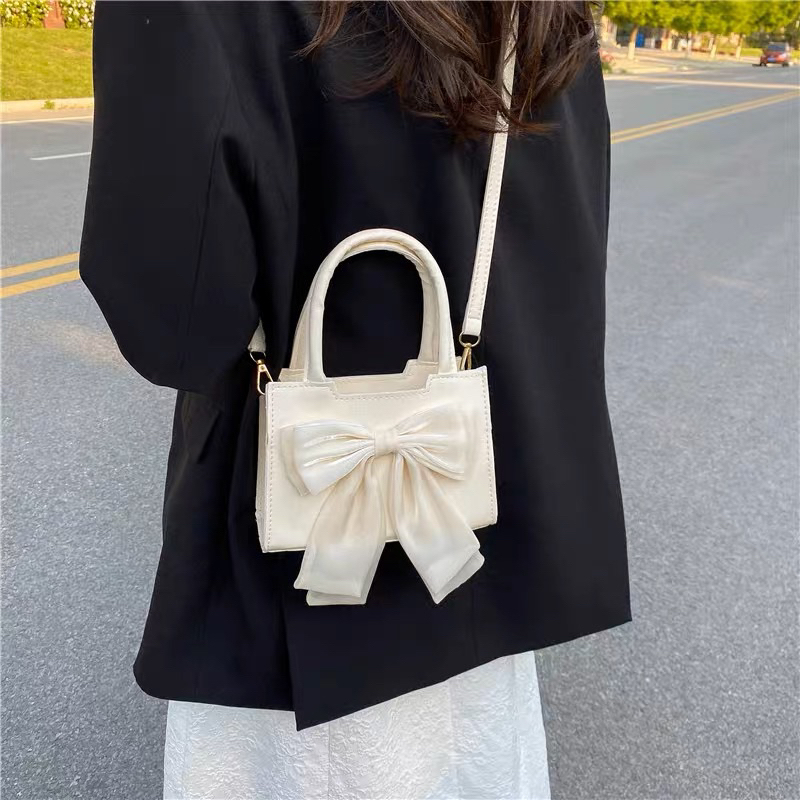 Túi xách đeo vai da PU đính nơ kiểu dáng đơn giản thời trang cho nữ. Túi nữ đeo chéo gắn nơ vải to dễ thương Hottrend | BigBuy360 - bigbuy360.vn