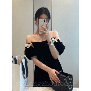 Váy nhung trễ vai đính nơ