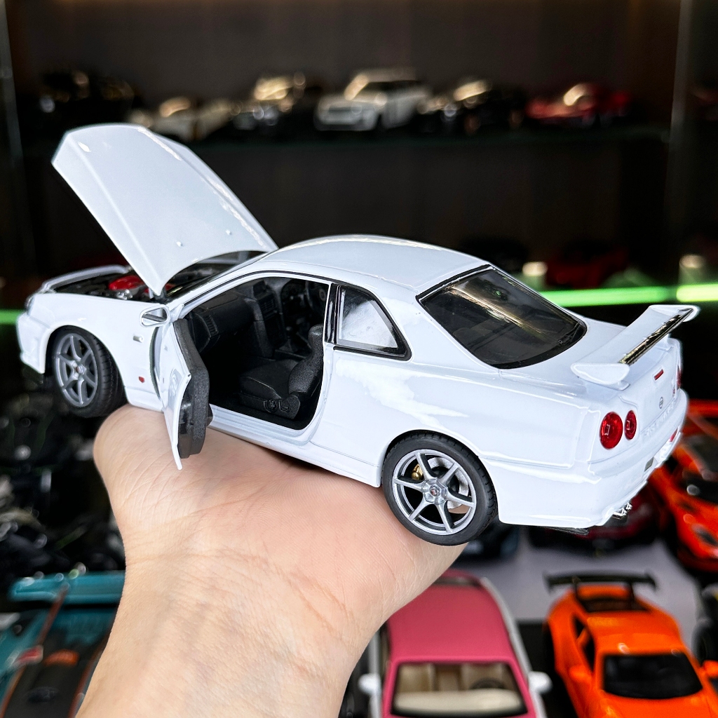 Mô hình xe ô tô tĩnh Nissan R34 Skyline tỉ lệ 1:24 hãng Welly 2 màu