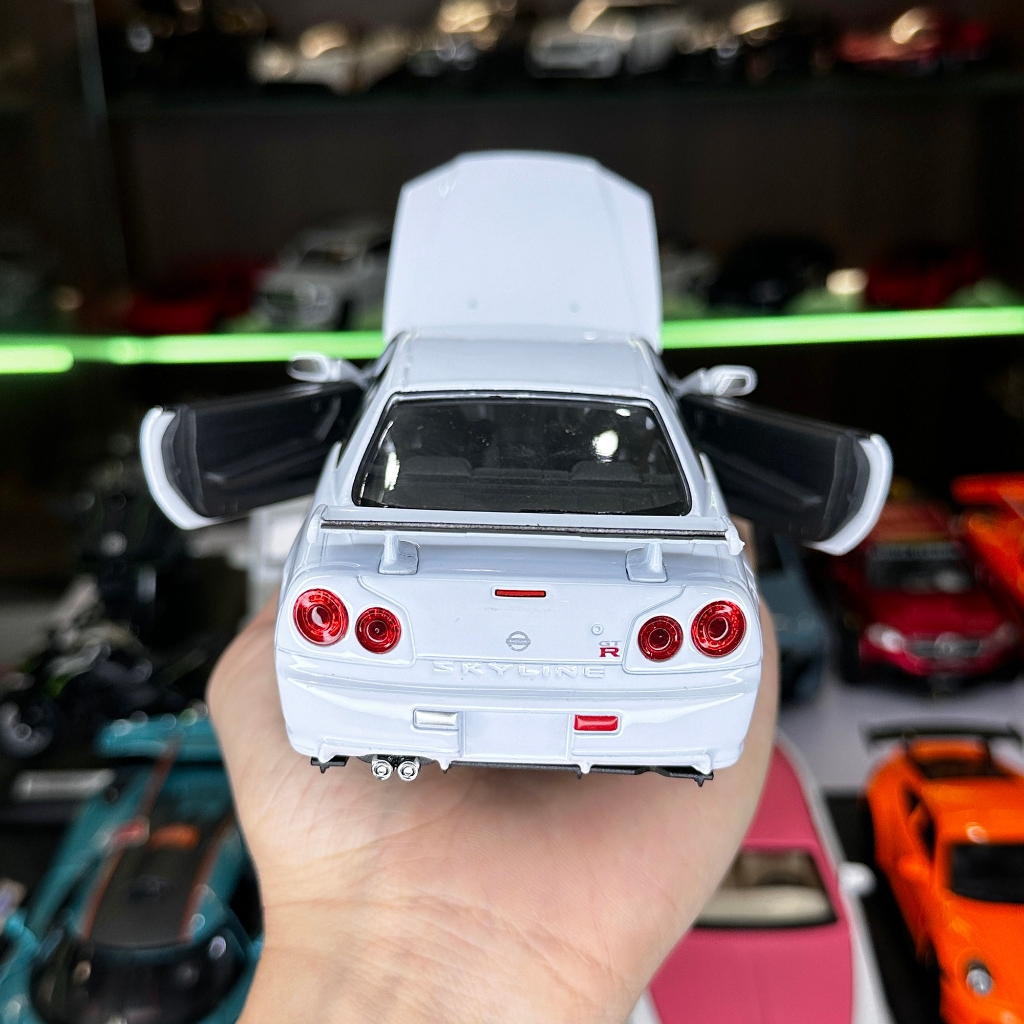 Mô hình xe ô tô tĩnh Nissan R34 Skyline tỉ lệ 1:24 hãng Welly 2 màu