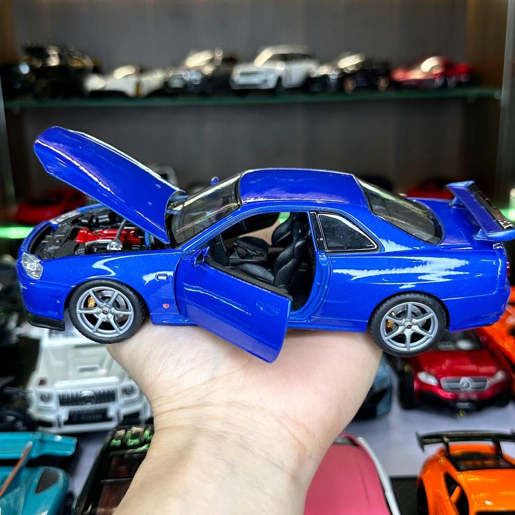 Mô hình xe ô tô tĩnh Nissan R34 Skyline tỉ lệ 1:24 hãng Welly 2 màu
