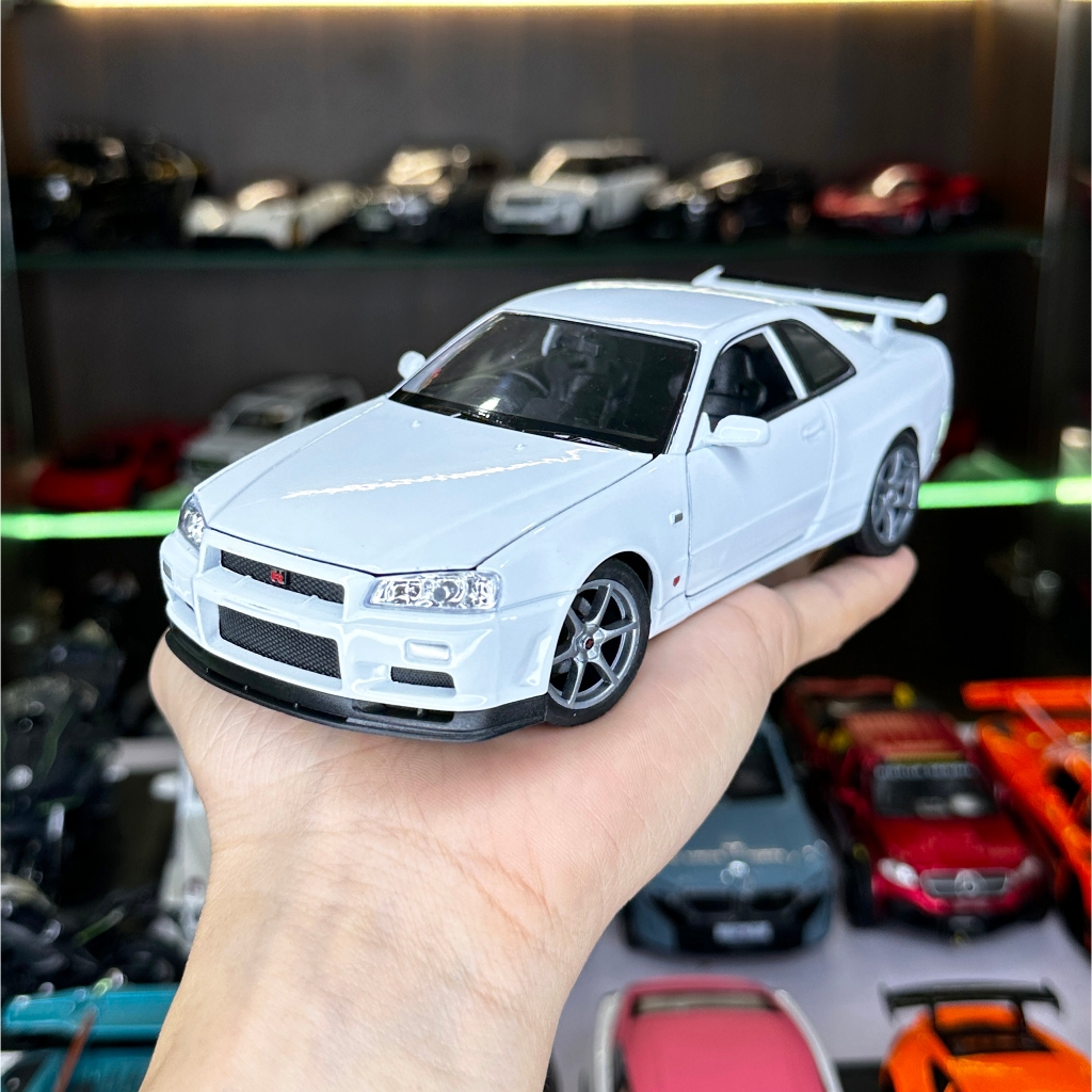 Mô hình xe ô tô tĩnh Nissan R34 Skyline tỉ lệ 1:24 hãng Welly 2 màu