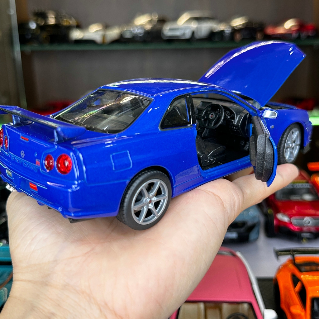 Mô hình xe ô tô tĩnh Nissan R34 Skyline tỉ lệ 1:24 hãng Welly 2 màu