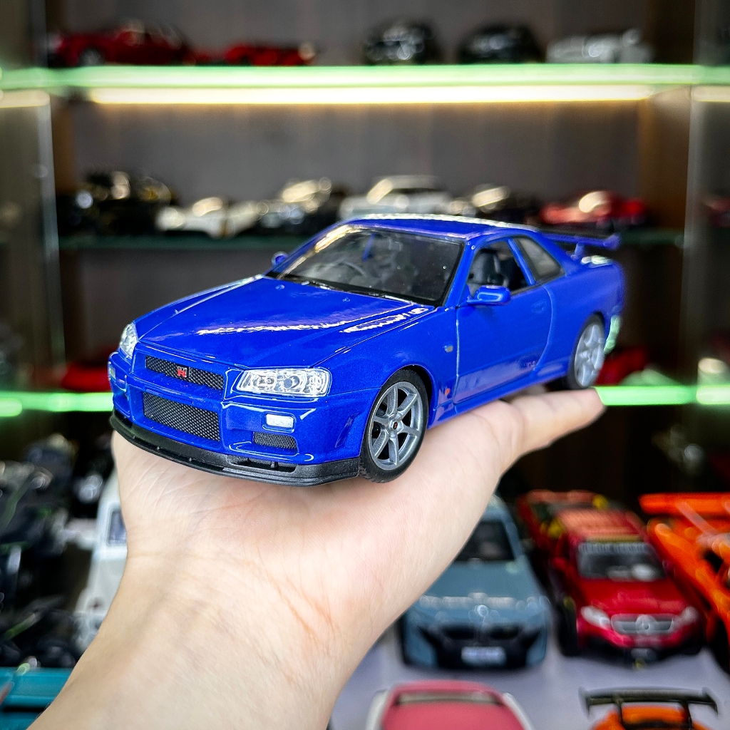 Mô hình xe ô tô tĩnh Nissan R34 Skyline tỉ lệ 1:24 hãng Welly 2 màu