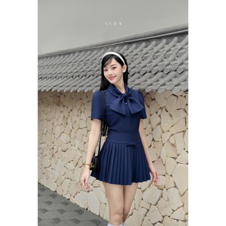 Sera - chân váy xếp ly đính nơ jolie