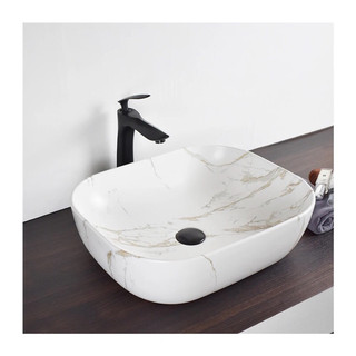 Chậu rửa mặt lavabo họa tiết đặt bàn đá.