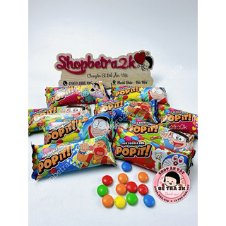 Kẹo socola sữa viên sắc màu Pop it Doraemon (gói 12g)