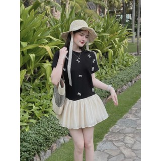 Đầm baby doll đen đính nơ phối kem xòe đuôi cá